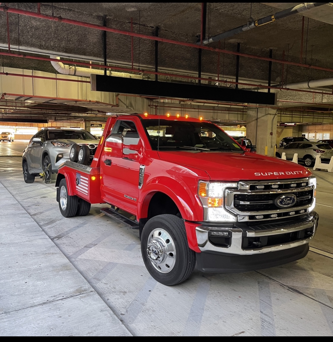 MayDay Tow Miami tow truck transporting a vehicle